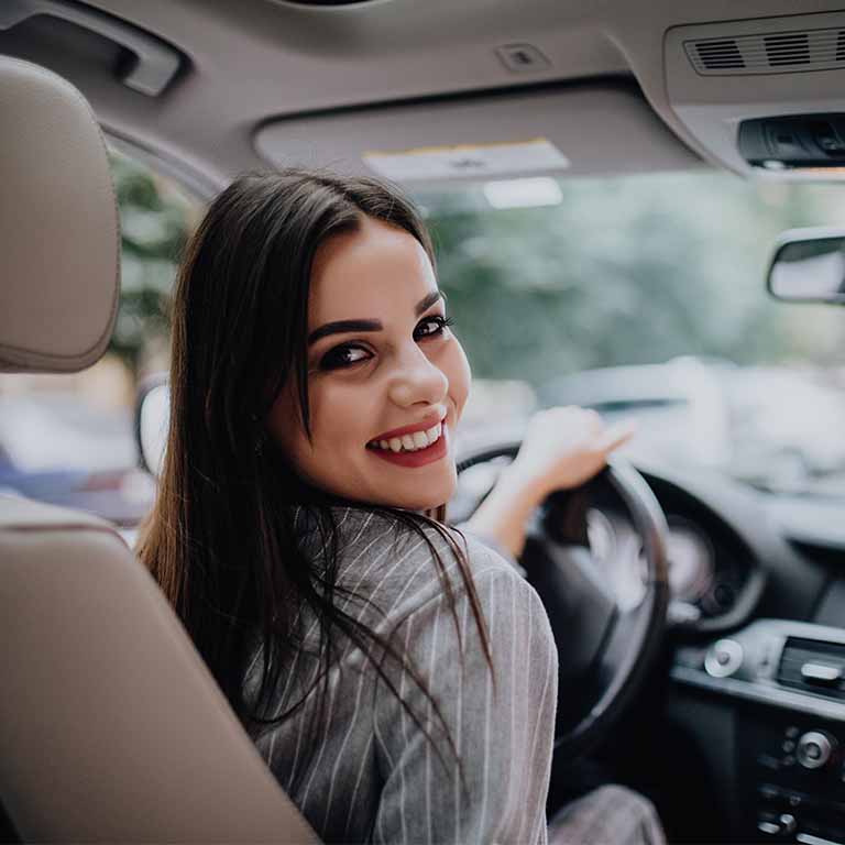 Woman Driving Looking Backwards